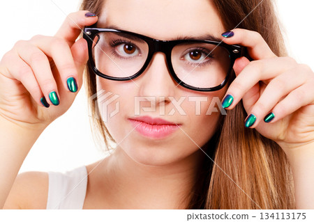 Happy nerdy teenage with brace wearing eyeglasses Happy nerdy teenage with brace wearing eyeglasses 134113175
