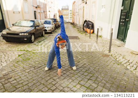 Cobbled street spectacle with lively acrobatics and bright energy Cobbled street spectacle with lively acrobatics and bright energy 134113221