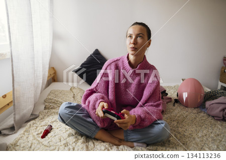 Cyclist leisure scene, Calm cyclist resting after ride in cozy bedroom 134113236