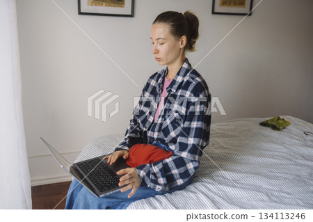Woman participating actively in digital team discussion from home 134113246