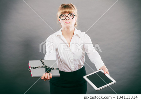 Woman with document and tablet. Digital storage. 134113314