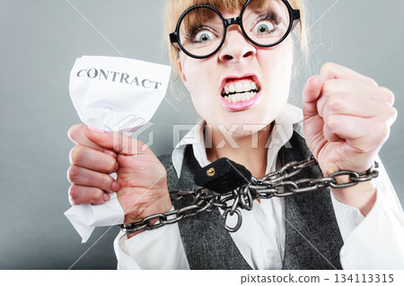 Furious woman with chained hands and contract 134113315