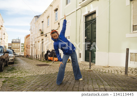 Casual street style captured with architectural accents and lighting 134113445