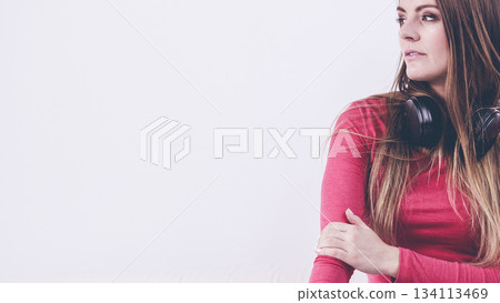 Young lady wearing headphones. Young lady wearing headphones. 134113469