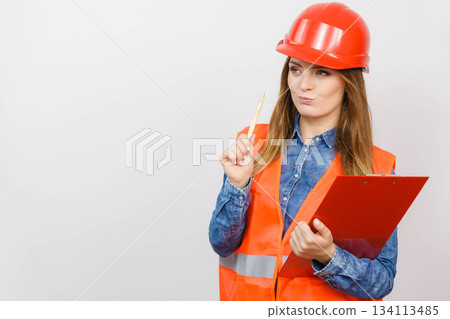 Woman engineer construction builder in helmet. 134113485