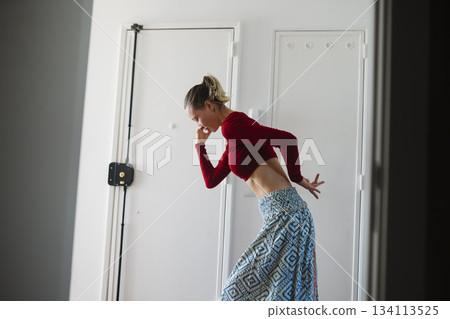 Thoughtful contemporary dance portrait with focused mood and shadows 134113525