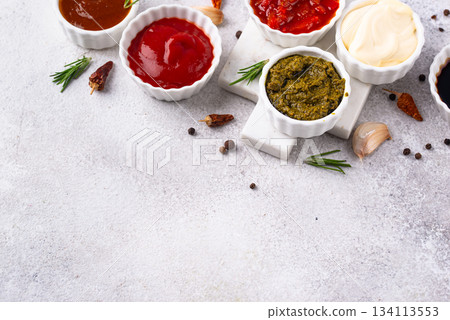 Set of different sauces. Ketchup, mustard, pesto Set of different sauces. Ketchup, mustard, pesto 134113553