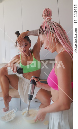 Enjoy a Fun and Engaging Cooking Session with Friends, All Dressed in Bright Outfits 134113615