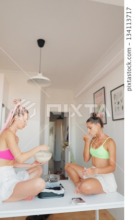 Two Women are Happily Enjoying a Casual Indoor Moment Together in a Comfortable Space 134113717