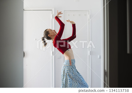 Refined stance depicting calmness amid plain surroundings 134113738