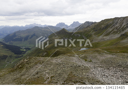 View from Gafier Joch into valley of Sankt Antonien showing lake Gafiersee on Smugglerpfad trail in Switzerland View from Gafier Joch into valley of Sankt Antonien showing lake Gafiersee on Smugglerpfad trail in Switzerland 134115485