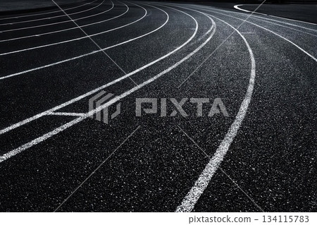 Dramatic Black Running Track with White Lines and Curves Dramatic Black Running Track with White Lines and Curves 134115783