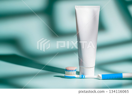 A toothbrush with a dab of pink toothpaste A toothbrush with a dab of pink toothpaste 134116065