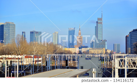 Warsaw, Poland. 28 November 2025. A panorama of the city with skyscrapers. In the foreground are high-voltage cables for electric trains at Warszawa Zachodnia station. 134116172