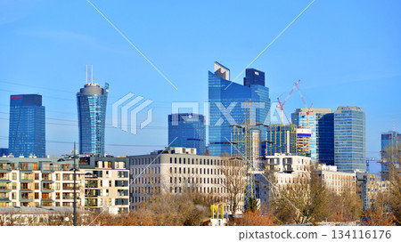 Warsaw, Poland. 28 November 2025. A panorama of the city with skyscrapers. In the foreground are high-voltage cables for electric trains at Warszawa Zachodnia station. 134116176