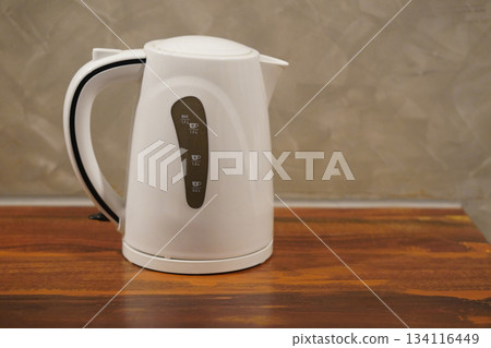 side view Black and white automatic keep warm electric air pots placed on a wooden floor, cement wall background, technology, electronic, banner, copy space side view Black and white automatic keep warm electric air pots placed on a wooden floor, cement wall background, technology, electronic, banner, copy space 134116449