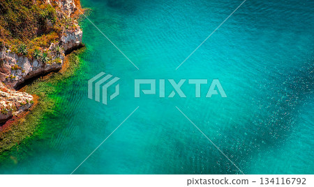 Turquoise seawater with a rugged coastline Turquoise seawater with a rugged coastline 134116792