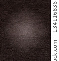 Dark brown fabric texture background with subtle vignette 134116836