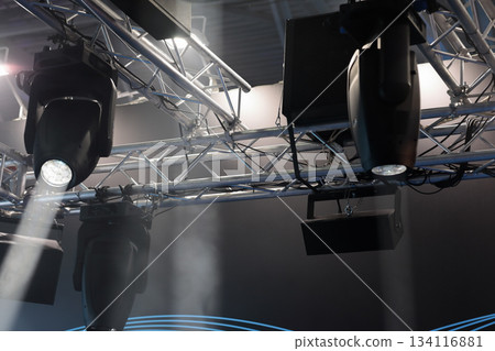 lighting fixtures hanging on truss over the stage 134116881