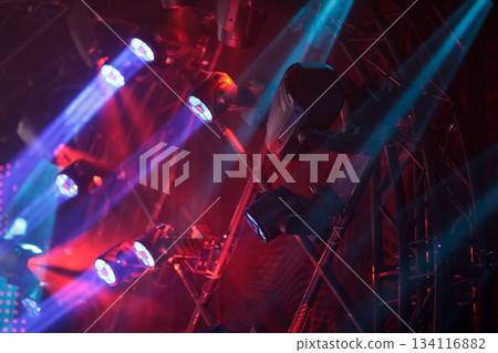 moving lights are hanging on a truss 134116882