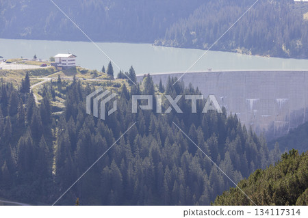 Stausee Kops in Gaschurn, Montafon, Vorarlberg, Austria shows the dam and surrounding forest Stausee Kops in Gaschurn, Montafon, Vorarlberg, Austria shows the dam and surrounding forest 134117314