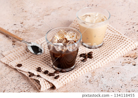 Pair of coffee glasses with iced drink and strong black coffee 134118455