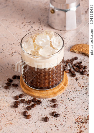 Iced coffee with milk and moka pot in simple modern setup 134118482