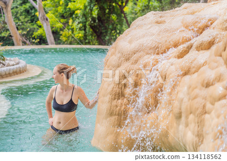 Female tourist exploring Grutas Tolantongo in Mexico, enjoying natural hot springs, scenic caves, and outdoor adventure. Travel, wellness, and sightseeing concept Female tourist exploring Grutas Tolantongo in Mexico, enjoying natural hot springs, scenic caves, and outdoor adventure. Travel, wellness, and sightseeing concept 134118562