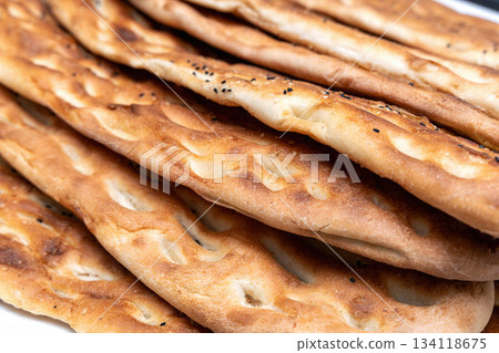 Golden crispy barbari bread fresh from oven today. Golden crispy barbari bread fresh from oven today. 134118675