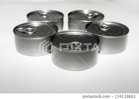 Group of tuna cans arranged together on white surface Group of tuna cans arranged together on white surface 134118681