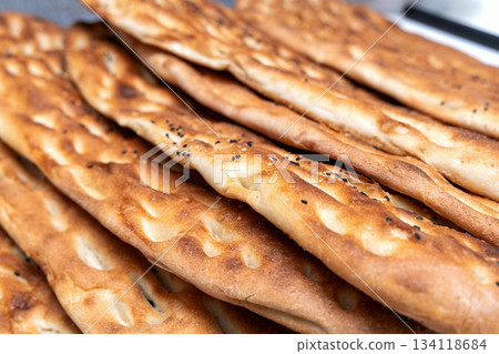 Traditional middle eastern flatbread laid out in row. 134118684