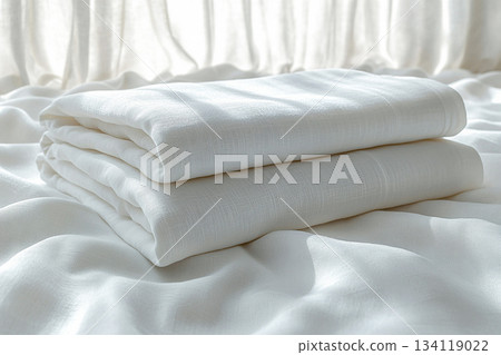 Neutral color. Cotton sheets on a white background. Stack of comfortable white sheets. 134119022