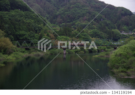 Deep green Kusaki Lake and the Watarase Valley Railway crossing the iron bridge Deep green Kusaki Lake and the Watarase Valley Railway crossing the iron bridge 134119194