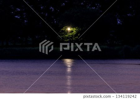 Night lights stretching over the surface of Shibayama Lake during the magic hour Night lights stretching over the surface of Shibayama Lake during the magic hour 134119242