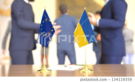EU - Ukraine support meeting with table flags, 3D rendering EU - Ukraine support meeting with table flags, 3D rendering 134119359