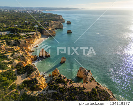 Marinha Beach, Cliffs and Atlantic Ocean on Sunny Day. Aerial View. Portugal 134119377