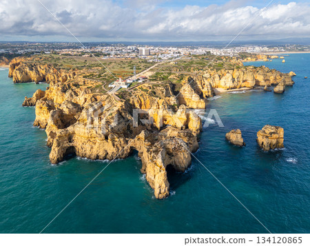 Ponta da Piedade Headland, Atlantic Ocean on Sunny Day. Aerial Shot. Algarve, Portugal Ponta da Piedade Headland, Atlantic Ocean on Sunny Day. Aerial Shot. Algarve, Portugal 134120865