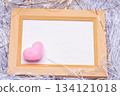 Composition with pink heart ornaments in a wooden frame 134121018