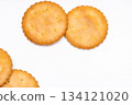 A simple composition of round biscuits arranged on a white background 134121020