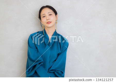 Woman in blue blouse Woman in blue blouse 134121257
