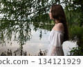 Whispers of Serenity: Woman in White Off-Shoulder Dress by Birch-Lined Lake 134121929