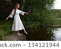Ethereal Grace: Woman in White Lace Dress by Forest Pond 134121944
