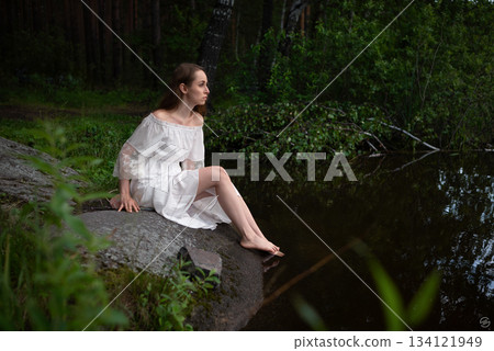 Serene Solitude: Woman in White Dress by Forest Pond Serene Solitude: Woman in White Dress by Forest Pond 134121949