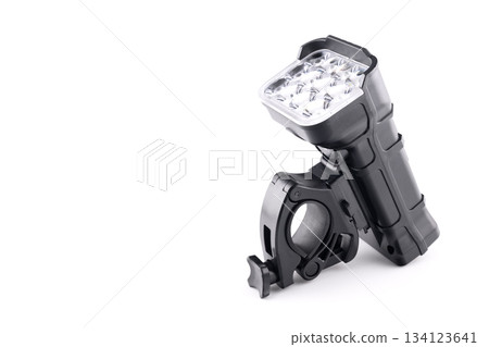 close-up of a black led bicycle light with an attached handlebar mount on a white background close-up of a black led bicycle light with an attached handlebar mount on a white background 134123641