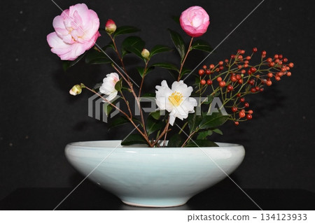 Camellia and wild rose flower arrangement 134123933