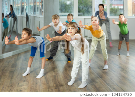 Group of children warming up before dance class Group of children warming up before dance class 134124720