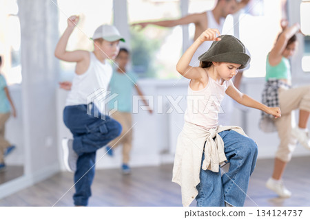 Tween girl mastering krump dance in children dance studio Tween girl mastering krump dance in children dance studio 134124737