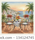 Mediterranean coastal scene featuring a terrace overlooking the sea during sunset. A round, wrought-iron table is set with plates of food, red wine glasses, and a bottled wine 134124745