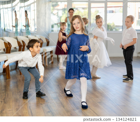 Beautifully dressed little boys and girls dance couple twist dance Beautifully dressed little boys and girls dance couple twist dance 134124821
