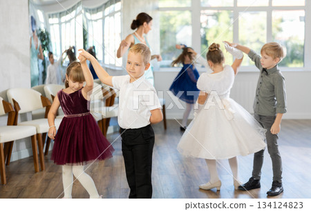 Classical dances performed by preteen children in festive clothes Classical dances performed by preteen children in festive clothes 134124823